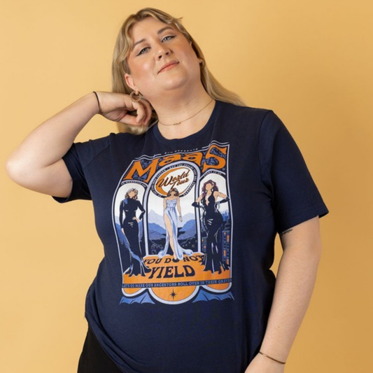 Model on a mustard background in a navy Maasverse Maas World Tour t-shirt, ACOTAR merch inspired by Sarah J. Maas