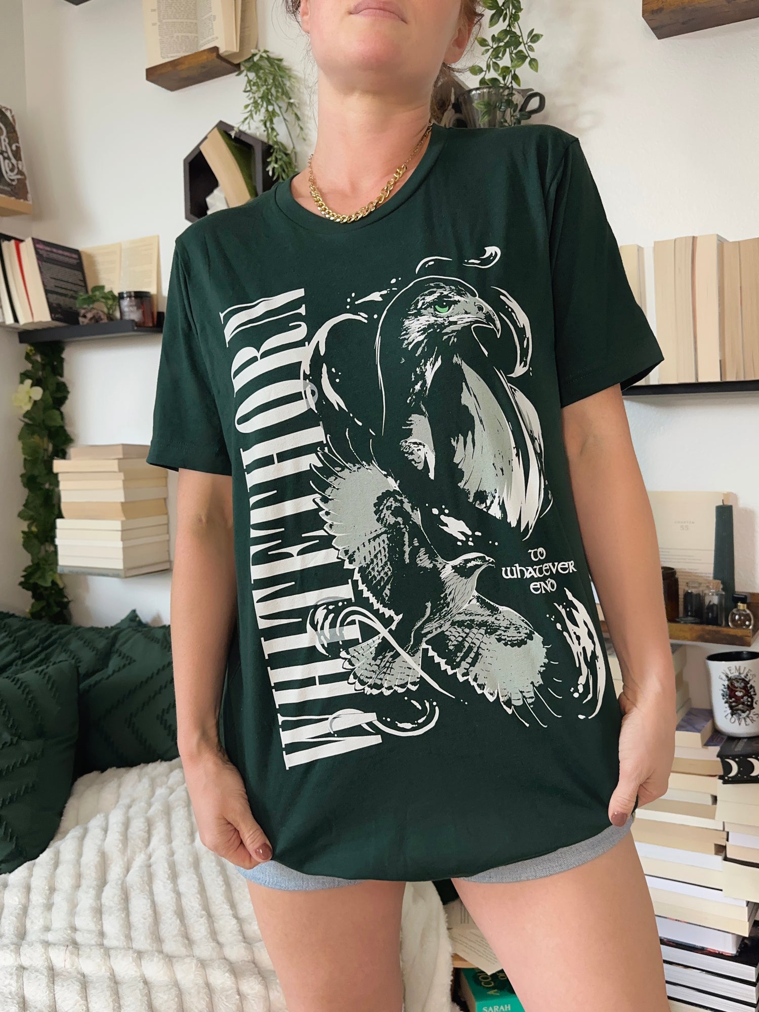 Dark green Rowan Whitethorn t-shirt with bold vertical text, white hawk illustration, and ‘To Whatever End’ quote from Throne of Glass by Sarah J Maas