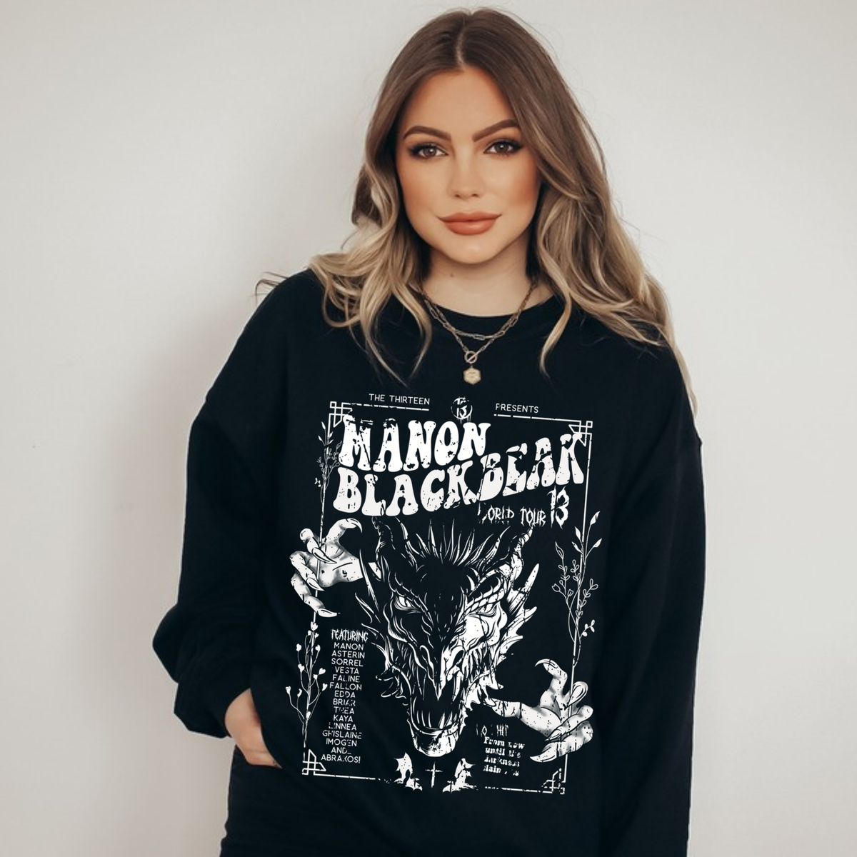 Model wearing the black Manon Blackbeak sweatshirt, Throne of Glass merch inspired by Sarah J. Maas