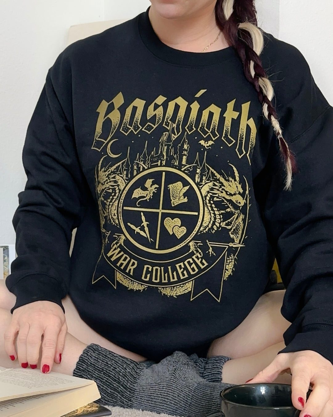 Basgiath War College Sweatshirt — Fourth Wing merch by Rebecca Yarros. The fortress that turns scribes into riders. Hand-designed in Australia, officially licensed.