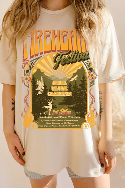 Model wearing a cream oversized t-shirt with a vintage festival-style print inspired by Throne of Glass by Sarah J. Maas, featuring Aelin Galathynius and Rowan Whitethorn.