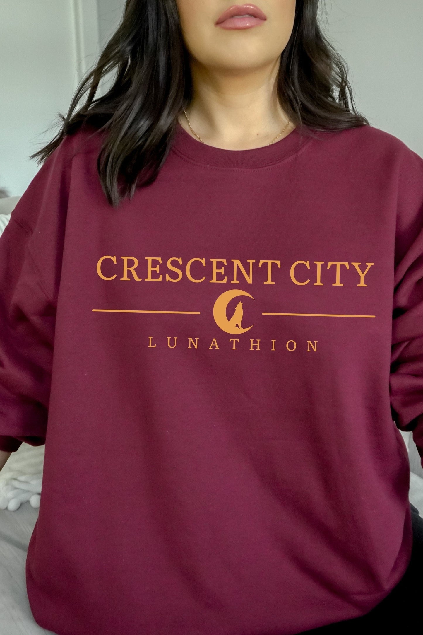 Crescent City Sweatshirt — Crescent City merch by Sarah J. Maas. Bryce, Hunt, and the Asteri-burning truth. Hand-designed in Australia, officially licensed.