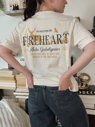Off-white Fireheart t-shirt with large back design featuring ‘To Whatever End,’ Aelin Galathynius quote, antlers, swords, and crown from Throne of Glass by Sarah J Maas