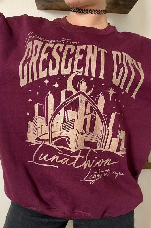 Greetings From Crescent City Sweatshirt — Crescent City merch by Sarah J. Maas. The postcard from the city of Bryce and Hunt. Hand-designed in Australia, officially licensed.