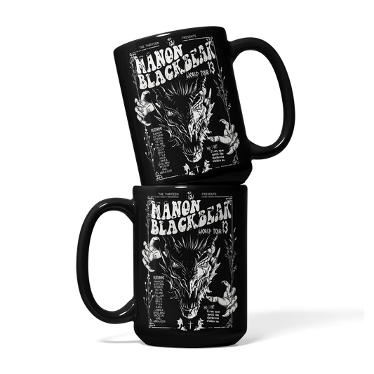 Two stacked black mugs printed with a white Manon Blackbeak World Tour wyvern poster and the names of the Thirteen, inspired by Throne of Glass by Sarah J. Maas