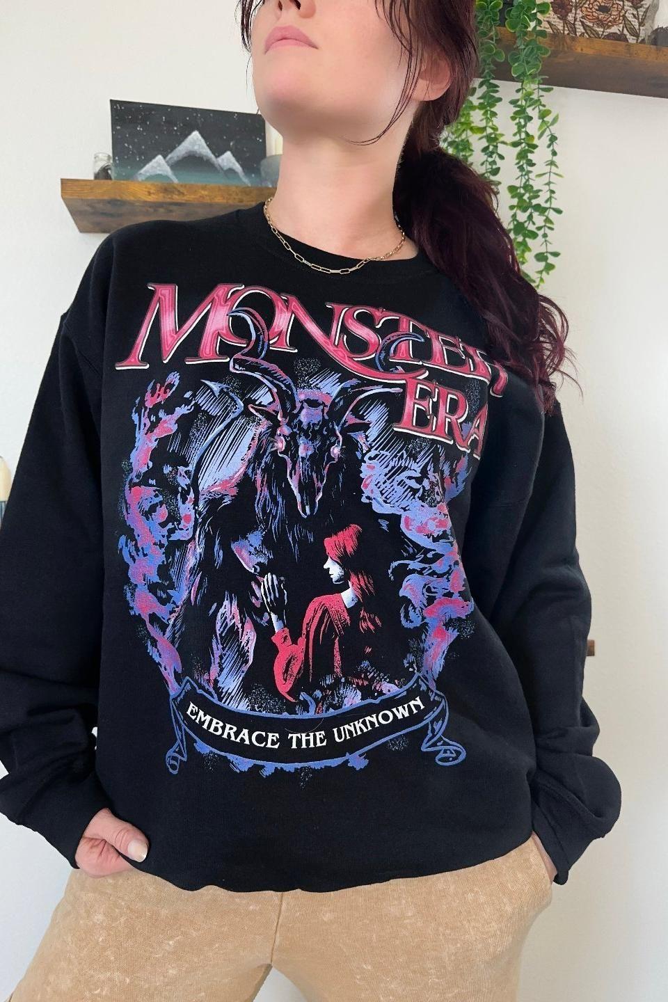 Monster Era Sweatshirt — bookish merch by Caffeine and Curses. Welcome to your monster era — fangs and feelings. Hand-designed in Australia.