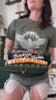 Throne of Glass try-on — Whitethorn tee worn, holding the Maas, Manon Blackbeak, Fireheart and Terrasen designs