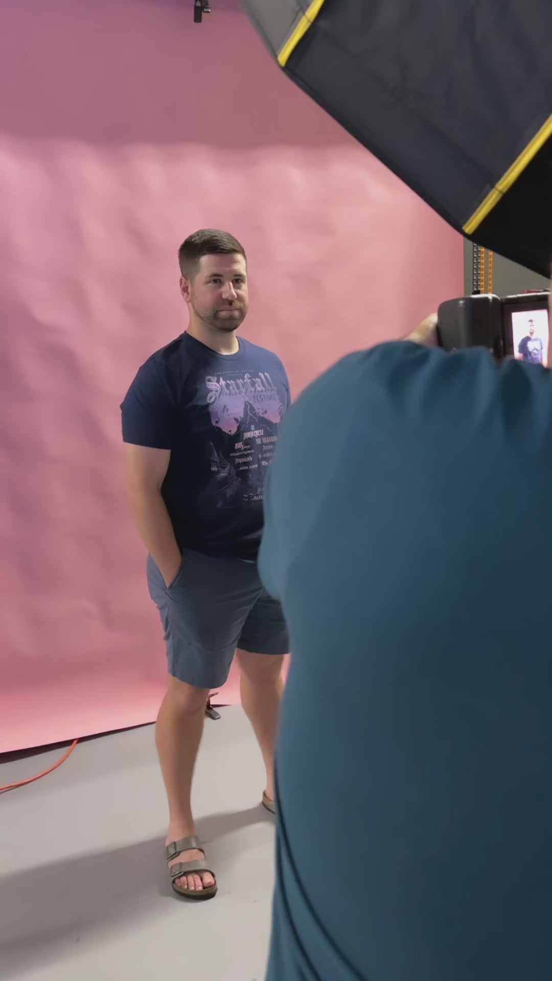 Try-on video: the navy Starfall t-shirt — the Starfall Festival poster print with the mountain under a violet night sky [focal 50 35]