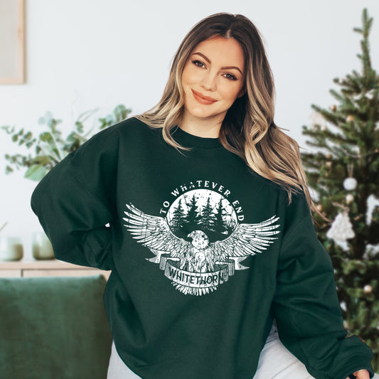 Model wearing a forest green Rowan Whitethorn sweatshirt with a white hawk over pines and a WHITETHORN banner, inspired by Throne of Glass by Sarah J. Maas