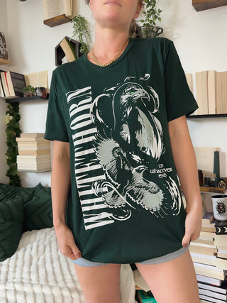 Dark green Rowan Whitethorn t-shirt with bold vertical text, white hawk illustration, and ‘To Whatever End’ quote from Throne of Glass by Sarah J Maas