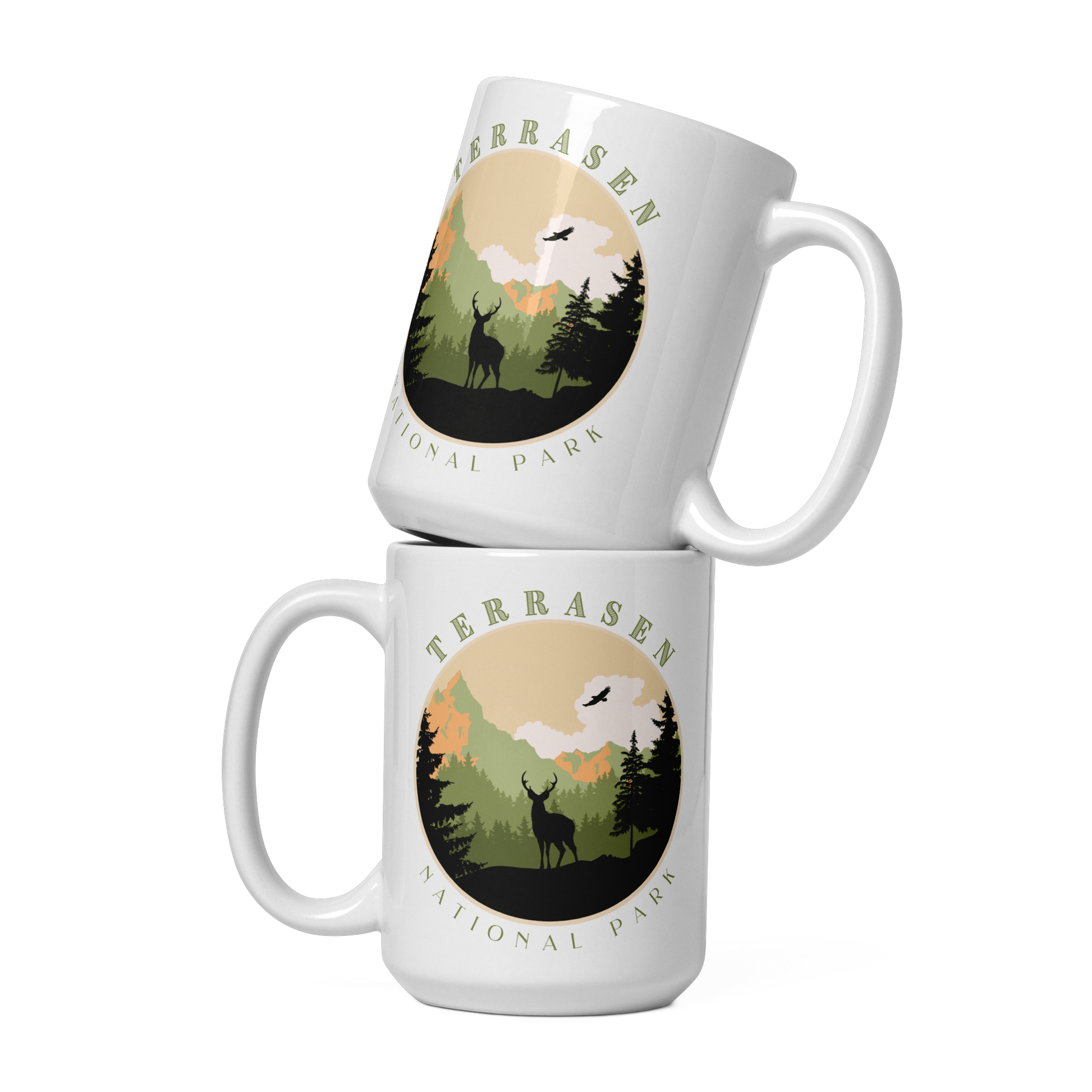 Two stacked white mugs carrying a circular TERRASEN NATIONAL PARK badge with a stag, pine forest and mountains, inspired by Throne of Glass by Sarah J. Maas