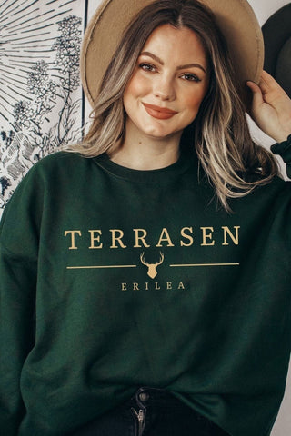 Dark green Terrasen sweatshirt with gold minimalist text and stag emblem, inspired by Sarah J Maas’s Throne of Glass kingdom of Erilea
