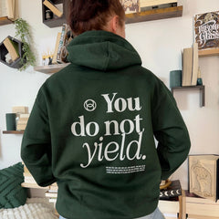 Back view of a forest green hoodie printed with You do not yield in white type above an Aelin Fireheart quote, inspired by Throne of Glass by Sarah J. Maas